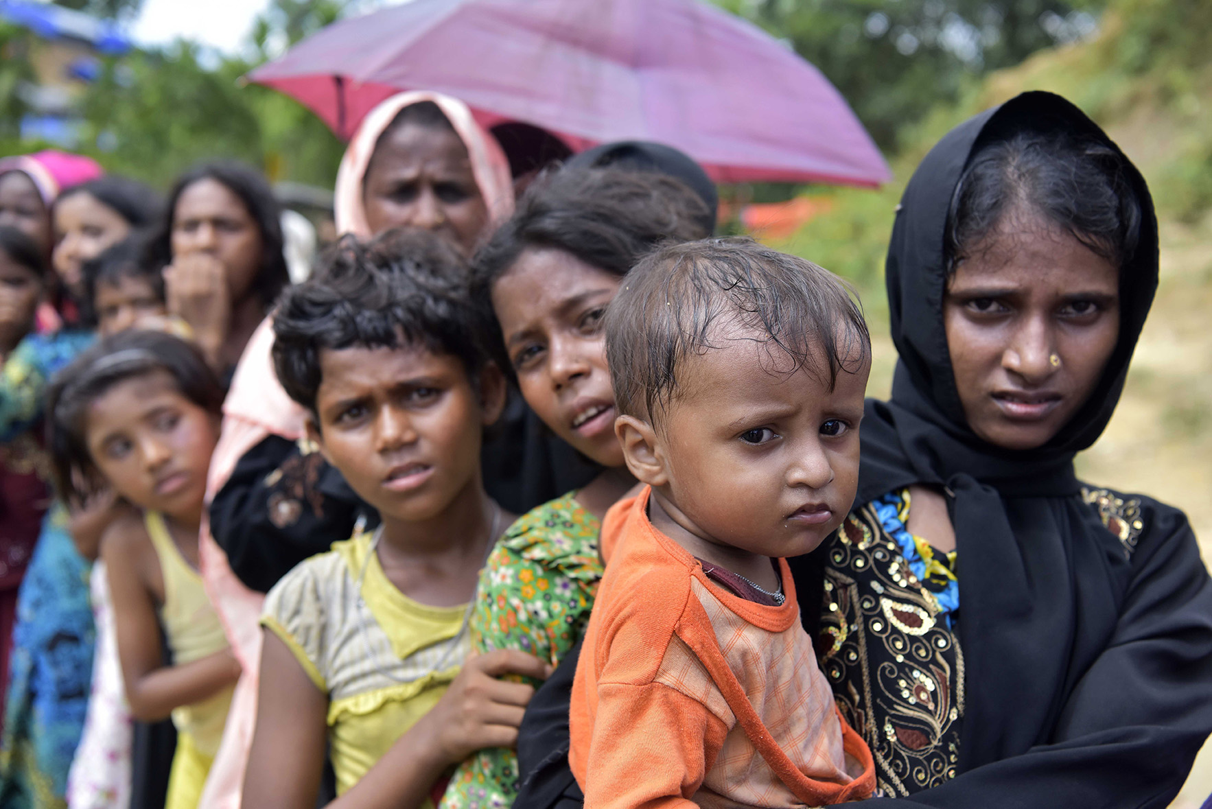 Rohingya wait in a queue in Cox's Bazar. Image by Sk Hasan Ali / Shutterstock.com. Bangladesh, 2017. Rohingya wait in a queue in Cox's Bazar. Image by Sk Hasan Ali / Shutterstock.com. Bangladesh, 2017.