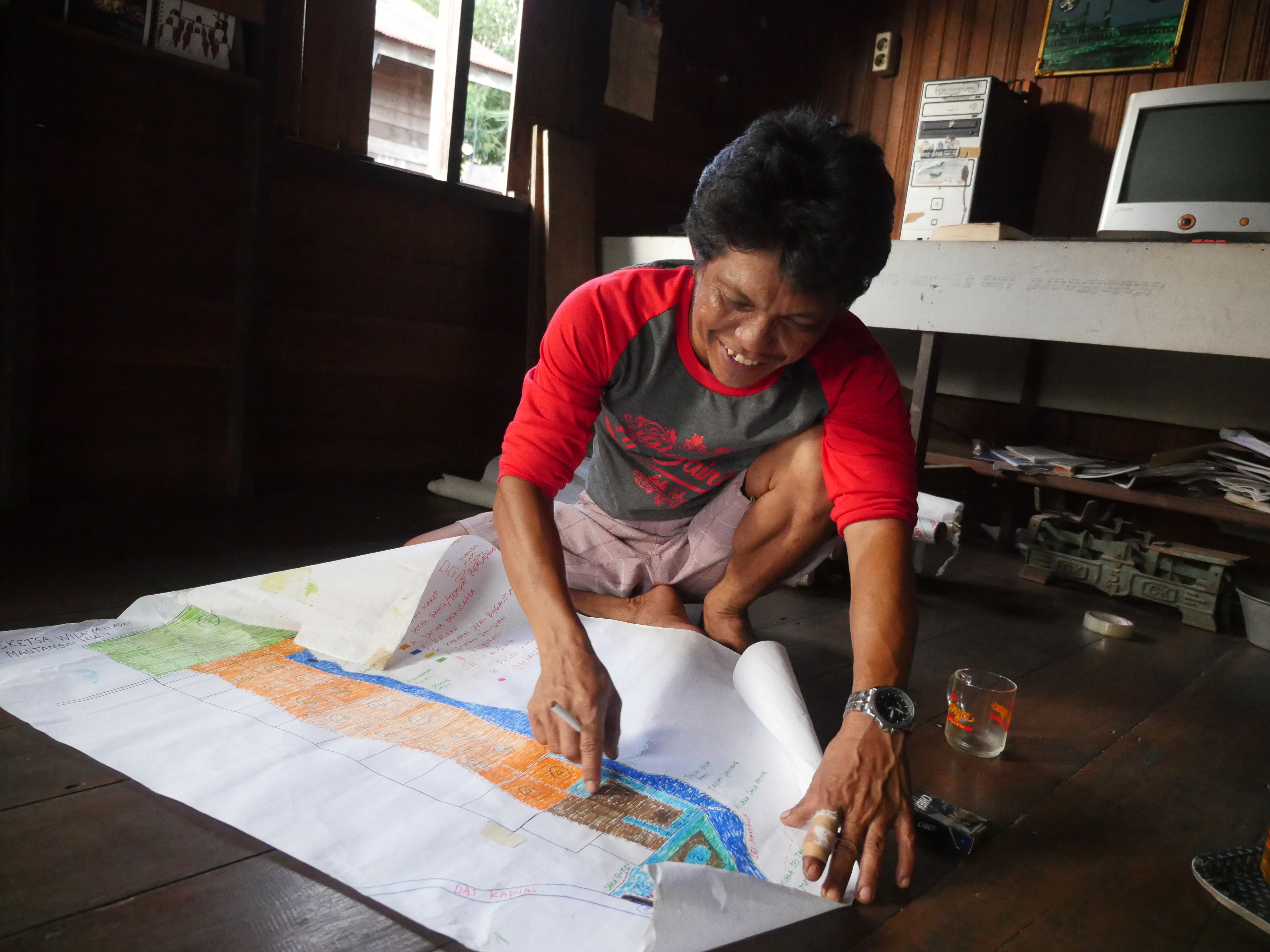 Montangai villagers were not asked for permission before government contractors cut down their forest crops, according to farmer Norhadi. Farmer Norhadi points to forest cleared to make room for the Mega Rice Project