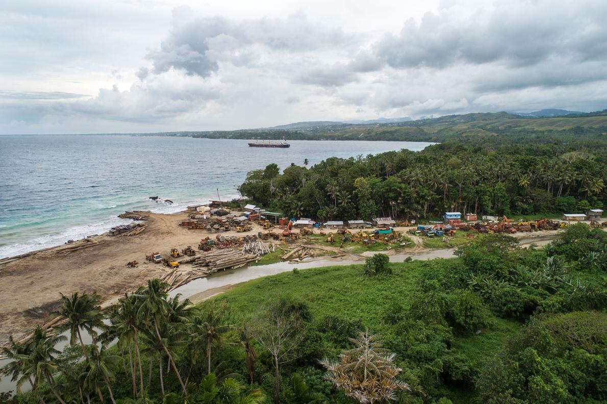 Logs are piled up on a beach, left there by a logging company. Moving single logs and equipment is often expensive, so companies will leave them at local sites. Image by Monique Jaques. Solomon Islands, 2020. Logs are piled up on a beach, left there by a logging company. Moving single logs and equipment is often expensive, so companies will leave them at local sites. Image by Monique Jaques. Solomon Islands, 2020.
