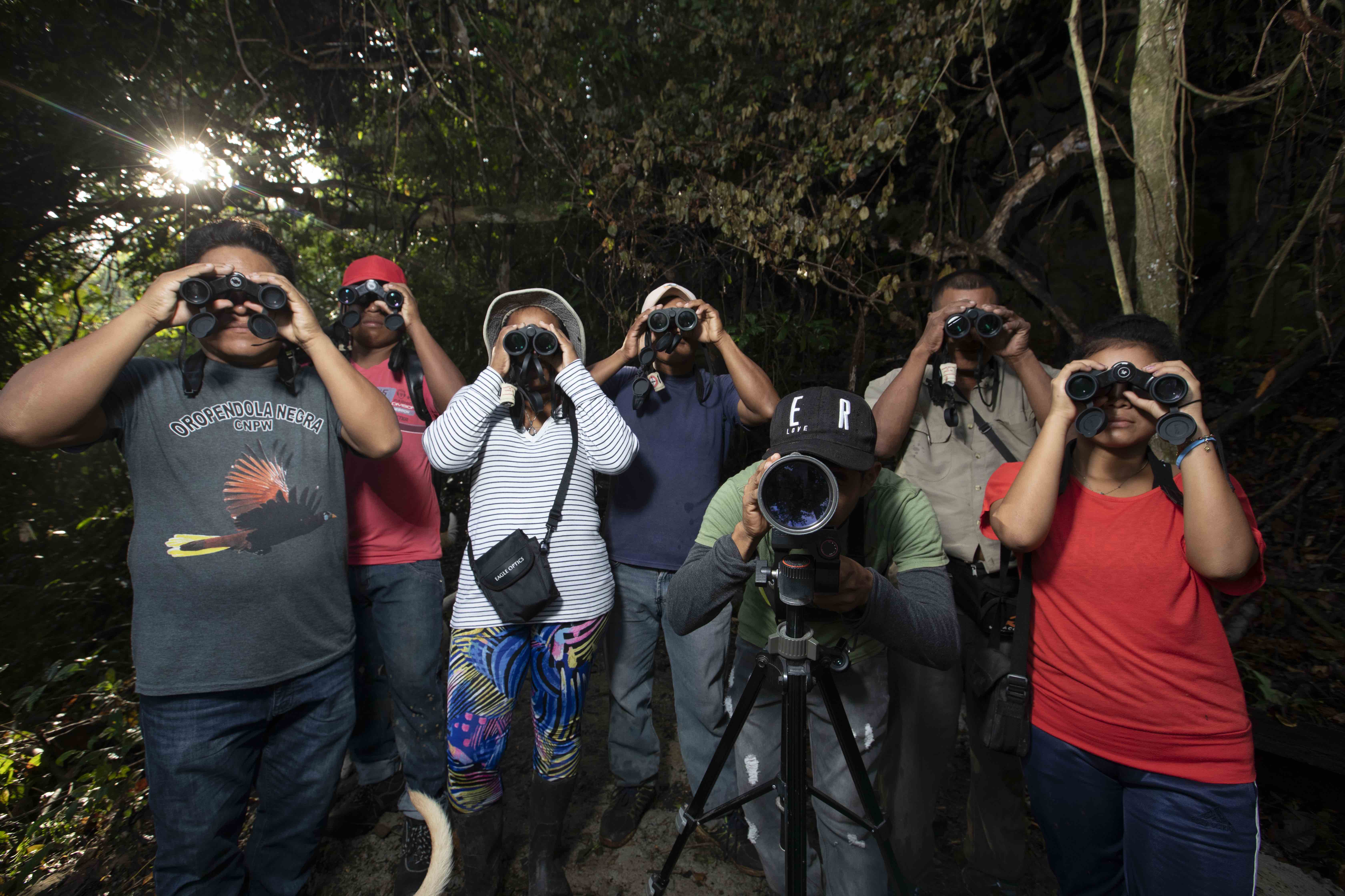A group of seven Wounaan men and two women in Puerto Lara decided to start monitoring and recording birds in their Darién forests. Image by Alexander Arosemena. Panama, 2019. A group of seven Wounaan men and two women in Puerto Lara decided to start monitoring and recording birds in their Darién forests. Image by Alexander Arosemena. Panama, 2019.
