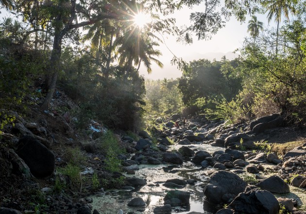 The trickle of a once-potent river on the island of Anjouan, in the Comoros. Image by Tommy Trenchard / The New York Times. Comoros, 2019. The trickle of a once-potent river on the island of Anjouan, in the Comoros. Image by Tommy Trenchard / The New York Times. Comoros, 2019.