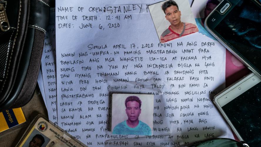 Image of a piece of paper that details the death of Stanley on June 6, 2020, written in Filipino. Placed on top of the paper are three small headshots of Stanley, his ID, and two cell phones.