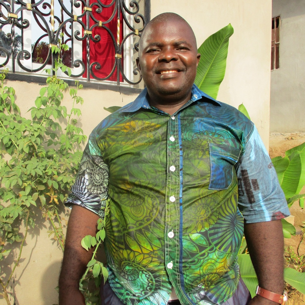 A man wears a green shirt.
