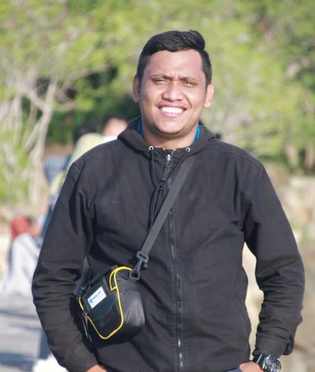 A man wearing a black long-sleeve.