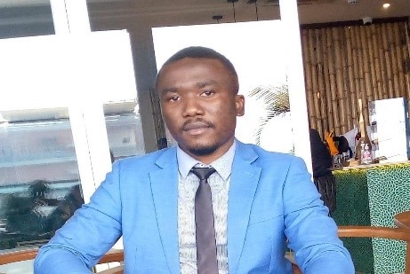 A man in blue suit.