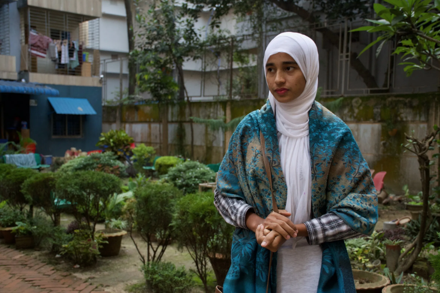 Formin in her backyard patio. Image by Sasha Ingber/ Music in Exile. Bangladesh, 2019. Formin in her backyard patio. Image by Sasha Ingber/ Music in Exile. Bangladesh, 2019.