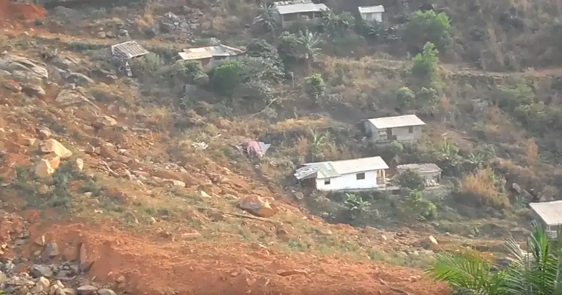 The scarred site of Sugar Loaf  Mountain that came tumbling down August 2017 claiming the lives of more than 1,000 Sierra Leoneans. Image by Kadia Goba. Sierra Leone, 2018.