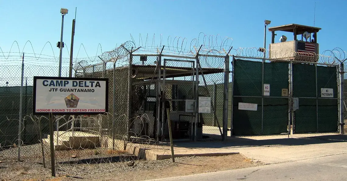 The entrance to Camp 1 in Guantanamo Bay's Camp Delta. The base's detention camps are numbered based on the order in which they were built, not their order of precedence or level of security. Photo by Kathleen T. Rhem. Cuba, 2018. Source: Wikimedia Commons.