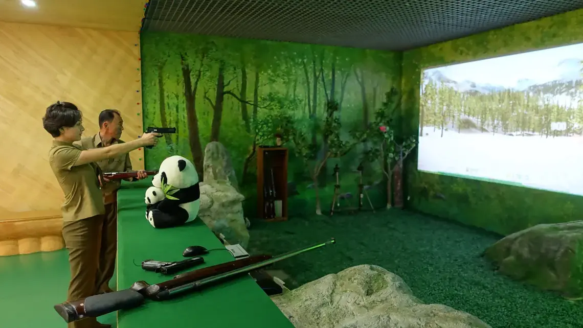 A North Korean citizen enjoying herself at a shooting range in Pyongyang. Image by Laya Maheshwari. North Korea, 2016.