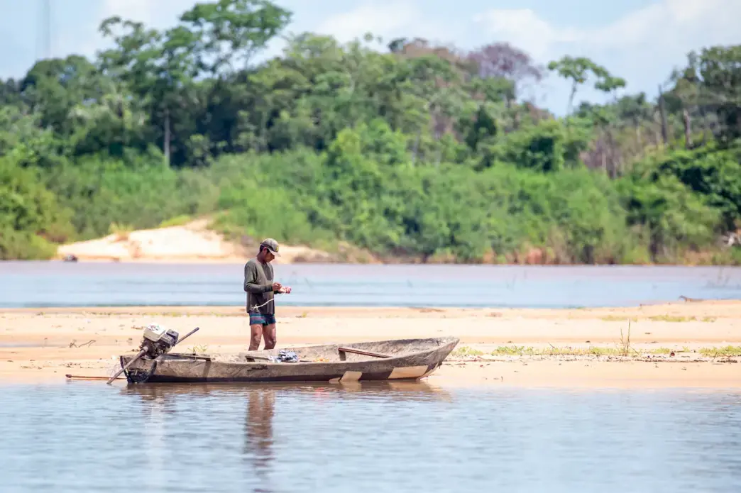 A man from a traditional Indigenous population preparing his boat and tools on the Araguaia river waters in Santa Terezinha, Mato Grosso. Image by JH Bispo/Shutterstock. Brazil, 2019. A man from a traditional Indigenous population preparing his boat and tools on the Araguaia river waters in Santa Terezinha, Mato Grosso. Image by JH Bispo/Shutterstock. Brazil, 2019.
