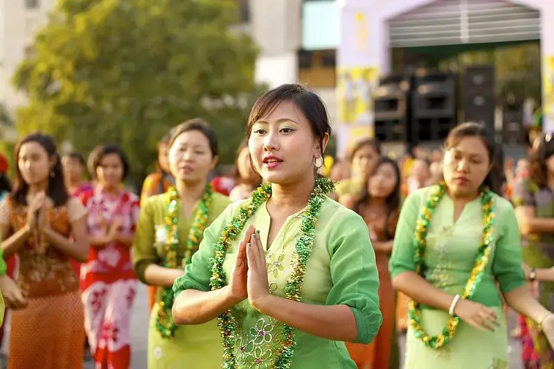 Burmese women perform traditional dance during closing ceremony of Myanmar New Year Water Festival 2011 in Yangon, Myanmar. Image by Htoo Tay Zar. Myanmar, 2011.