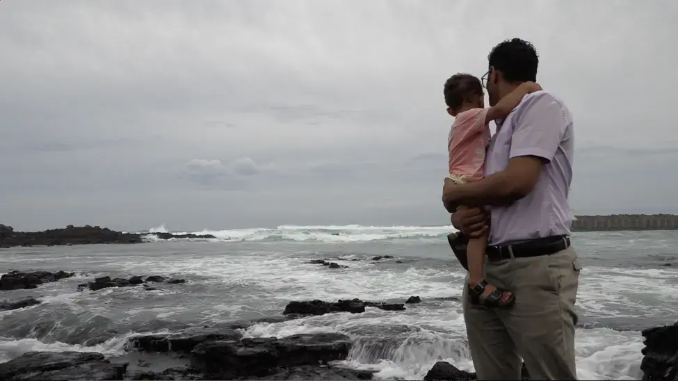Salem with his son Hamza in Jeju Island. Image by Saad Ejaz. South Korea, 2019.