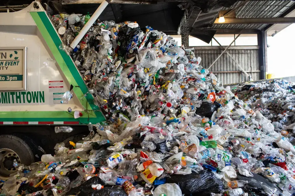 Plastic waste in Smithtown, N.Y., where plunging prices have pushed the recycling system beyond its limits. Image by Sebastian Meyer. Malaysia, 2020.