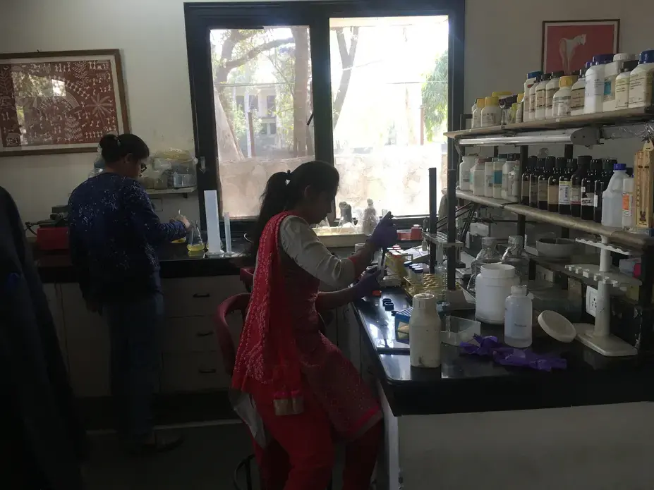 Two lab assistants prepare for clinical trials of a contraceptive vaccine at the Talwar Foundation in Delhi. Image by Hannah Harris Green. India, 2018.