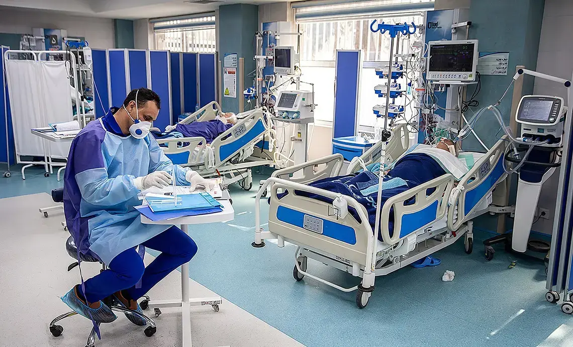 Coronavirus patients at the Imam Khomeini Hospital in Tehran, Iran. Image by Mohsen Atayi / Wikimedia Commons. Iran, 2020.