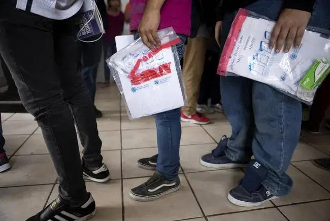 Migrants arrive in Nuevo Laredo after being returned to Mexico by U.S. Customs and Border Protection. The migrants requested asylum and must wait in Mexico for the duration of their immigration proceedings. Image by Miguel Gutierrez Jr. United States, 2019.