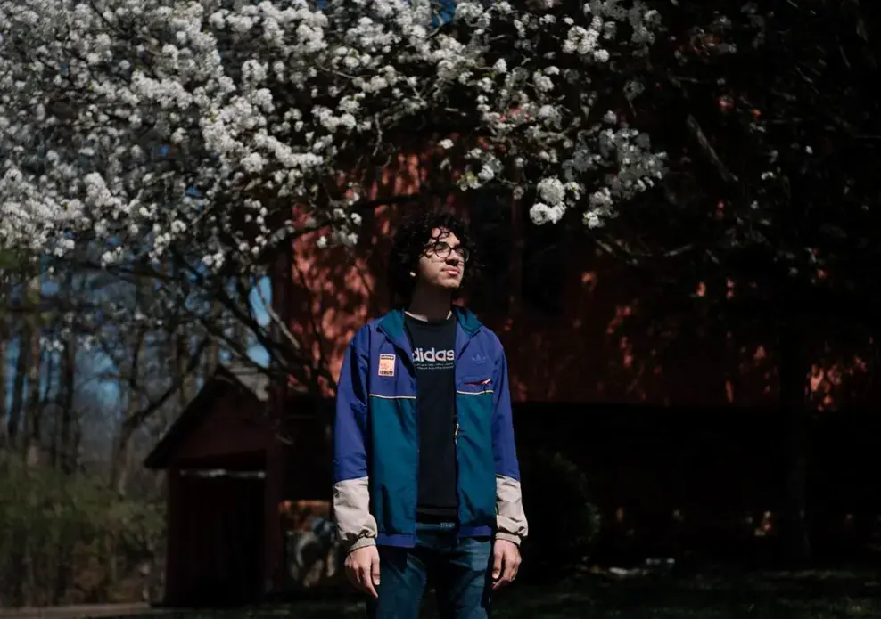Adam Lahlou, senior class president at Carbondale Community High School, stands for a portrait outside his home in Carbondale. Lahlou, like many seniors across the country, is living in uncertainty for the future of senior year while COVID-19 cases increase daily across the United States. Image by Brian Munoz. United States, 2020.