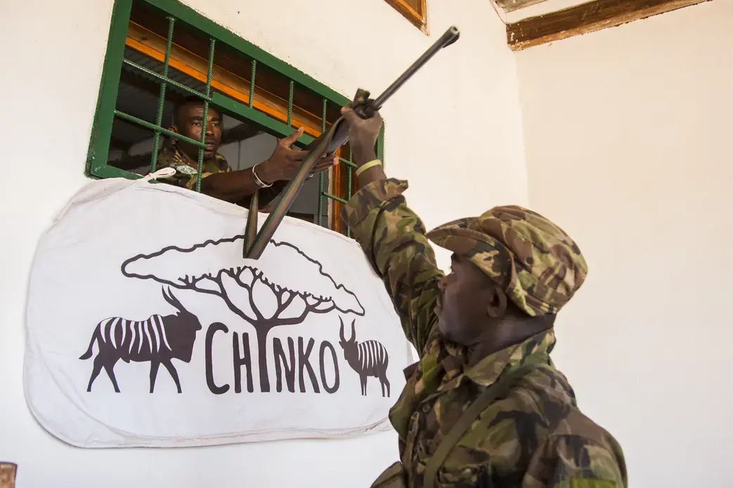 Returning from patrol, a ranger hands in his weapon to Chinko’s armory. Image by Jack Losh. Central African Republic, 2018.