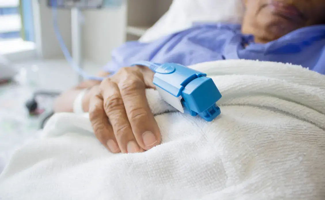 A finger pulse oximeter monitoring a patient's vital signs. Image courtesy Shutterstock.