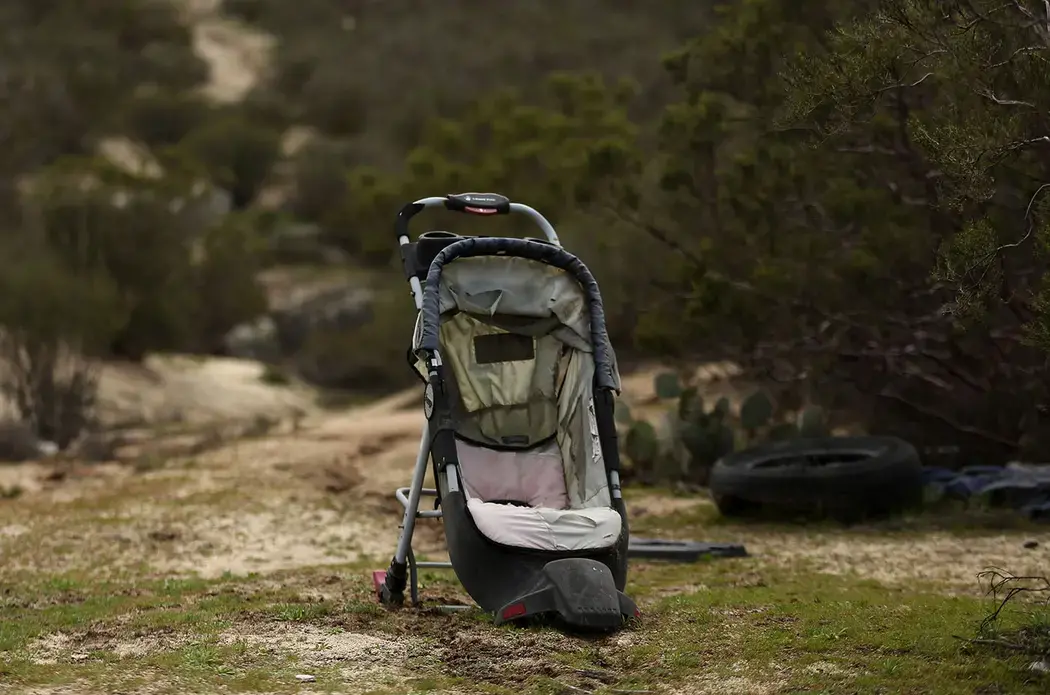 Personal items are left in the desert near the United States-Mexico border wall in Tecate, Mexico. This area is known to be a location for smugglers to bring people into the U.S. Image by Erika Schultz. Mexico, 2019.