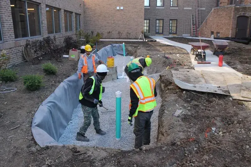 A Walnut Way Blue Skies team installing green infrastructure at a neighborhood church to manage stormwater. Image by Erica Heisdorf Bisquerra. United States, 2020.