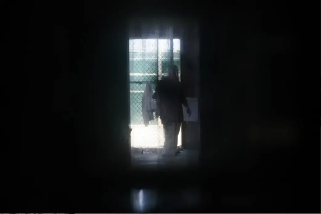 A prisoner at Guantánamo Bay’s Camp 6 detention center. Prisoners have been increasingly isolated at Guantánamo during the coronavirus pandemic. Image by Doug Mills / The New York Times. United States, undated.