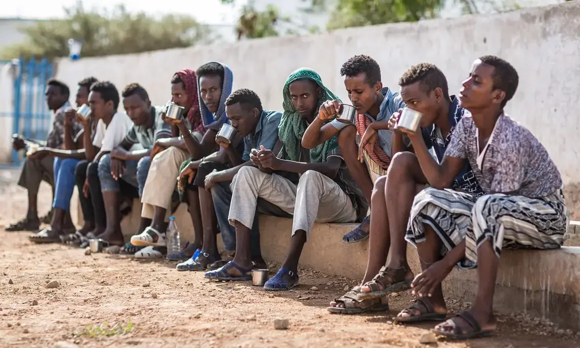 Ethiopians at the IOM transit centre in Obock, Djibouti, waiting to return home. People on the road to Obock told the Guardian that friends had perished en route. Image by Charlie Rosser. Djibouti, 2018.