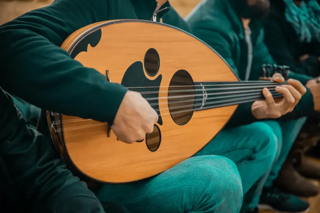 A musician plays an oud, a traditional Middle Eastern instrument. Image by Nayef Hammouri / Shutterstock. Palestinian Territories, undated.