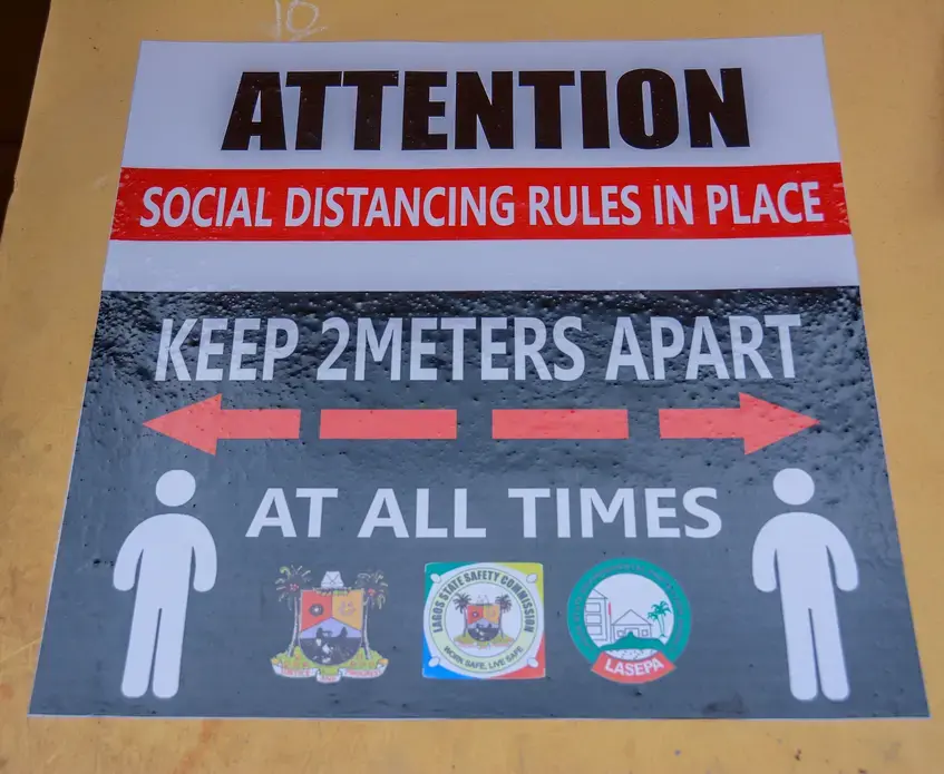 A poster on social distancing in a school in Lagos. Image by Oluwafemi Dawodu / Shutterstock. Nigeria, 2020.