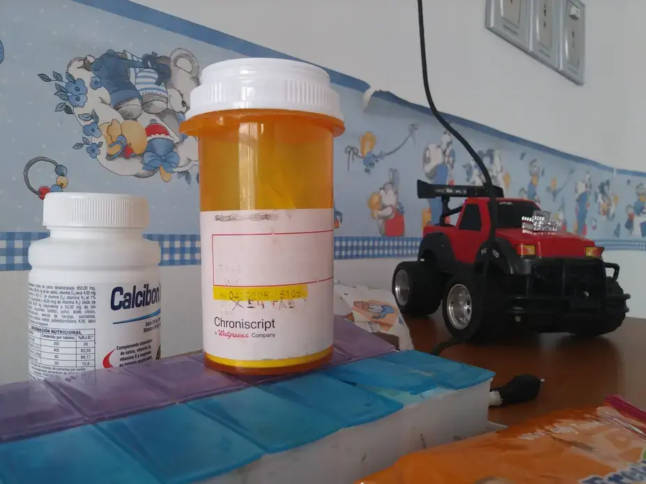 Eliécer Aguiar's medicine and toys on a table, at his hospitalization room in the Hospital J.M de los Ríos, in Caracas. Twelve-year-old Eliécer suffers from chronic kidney diesease and needs a kidney transplant, but with Venezuela's transplant system almost completely paralyzed and the organ waiting list still on hold, his future seems uncertain. Image by Flaviana Sandoval. Venezuela, 2018. 
