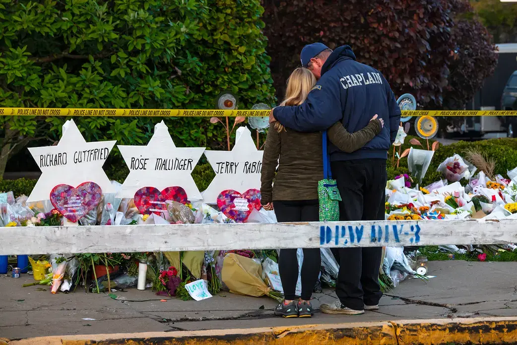 Chaplain Bob Ossler of Cape Coral FL comforts members of the community outside of the Tree of Life synagogue in Pittsburgh. Image by Brendt A Petersen / Shutterstock.com. United States, 2018.