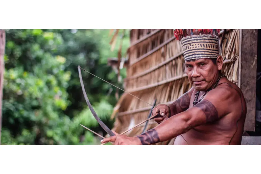Bernardino, the Campo Branco village tuxaua (leader). He has so far resisted threats from outsiders who have demanded he leave the Sateré’s ancestral lands on the Mariaquã River. Image by Matheus Manfredini. Brazil, 2019. Bernardino, the Campo Branco village tuxaua (leader). He has so far resisted threats from outsiders who have demanded he leave the Sateré’s ancestral lands on the Mariaquã River. Image by Matheus Manfredini. Brazil, 2019.