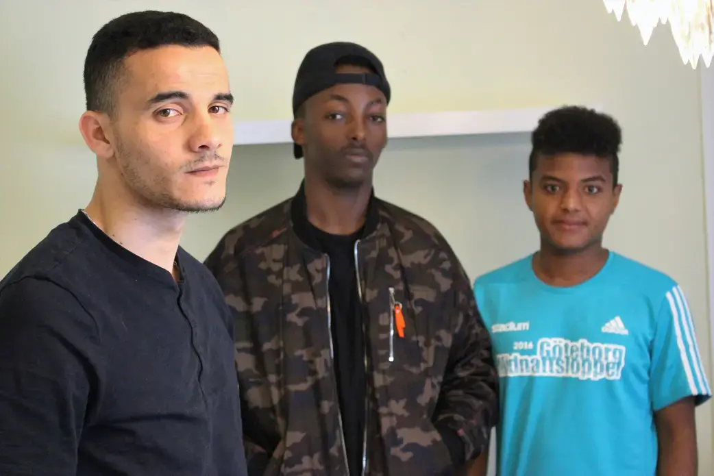 From left to right: Marwan, 16, from Mauritania by way of Morocco, Khalid, 15, from Ethiopia and Amar, 15, from Eritrea, in a Mölndal youth asylum center. Each is awaiting asylum. Image by Amy Russo. Sweden, 2017.