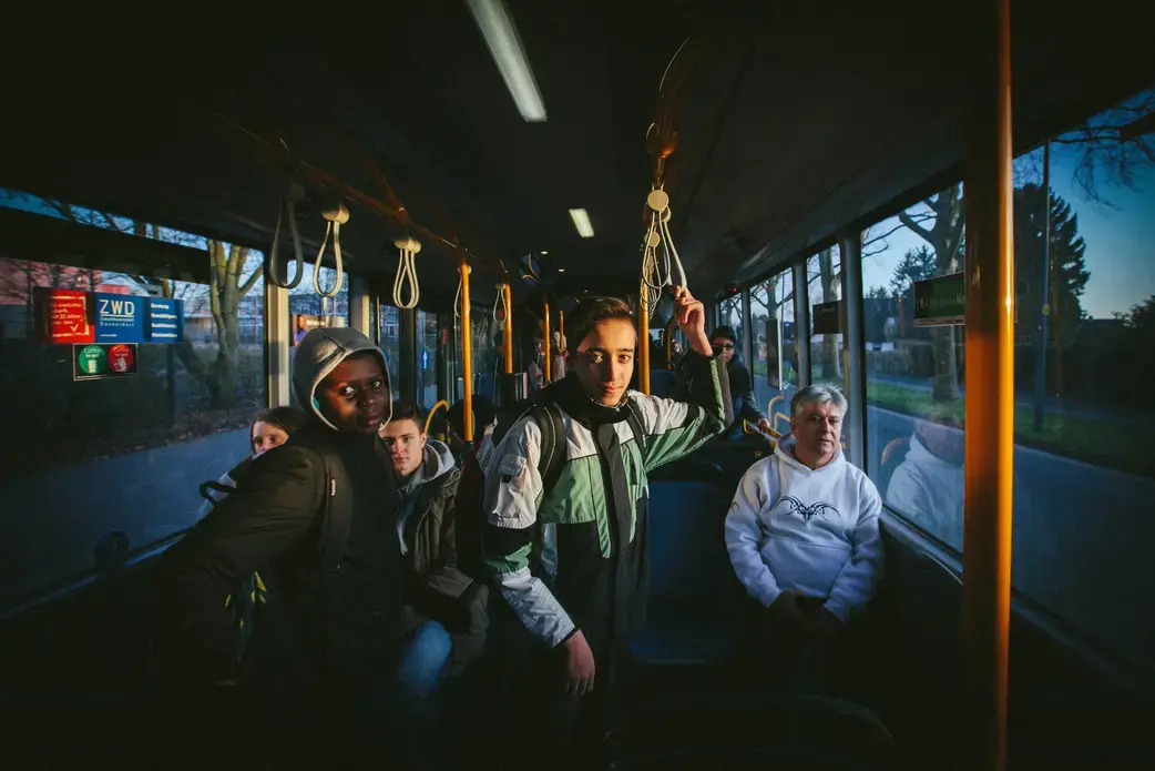 Milad began attending school while staying at a shelter in east Düsseldorf. After being relocated to the other side of the city, he continues to attend the same school, commuting an hour by bus and train each way, because of his attachment to friends and teachers. Image by Diana Markosian. Germany, 2016.