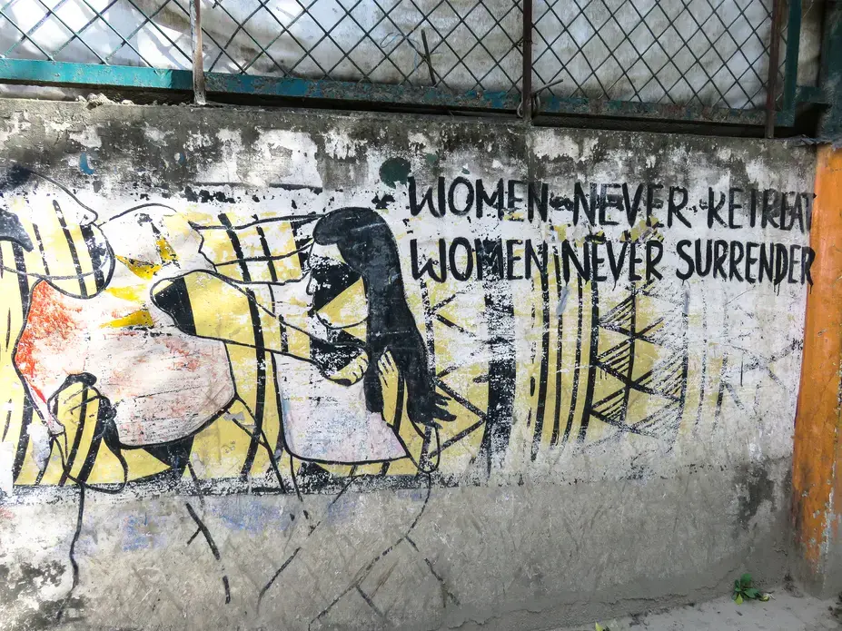 A mural in Kathmandu shows that women combat the violence inflicted upon them. Image by Nicole Brigstock. Nepal, 2018.