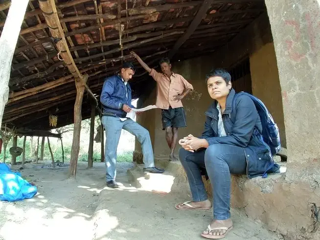 Nikita Sonavane (right) and Rameshbhai Dhoom from the Centre for Social Justice gather information outside the home of a woman murdered in a witch hunt in Gujarat. Image by Seema Yasmin. India, 2017.