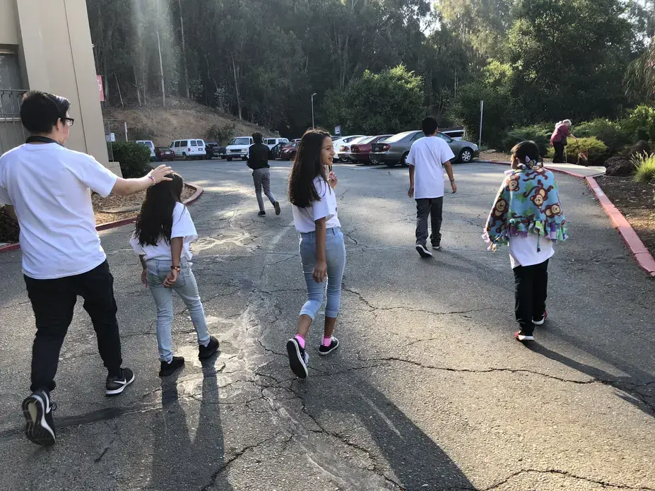 Campers head out to see their moms on the final day of the weeklong summer camp. Usually, they talk and play games on the drive. On this day, there was only the sound of tires whizzing down the interstate. Image by Jaime Joyce for TIME Edge. California, 2018.