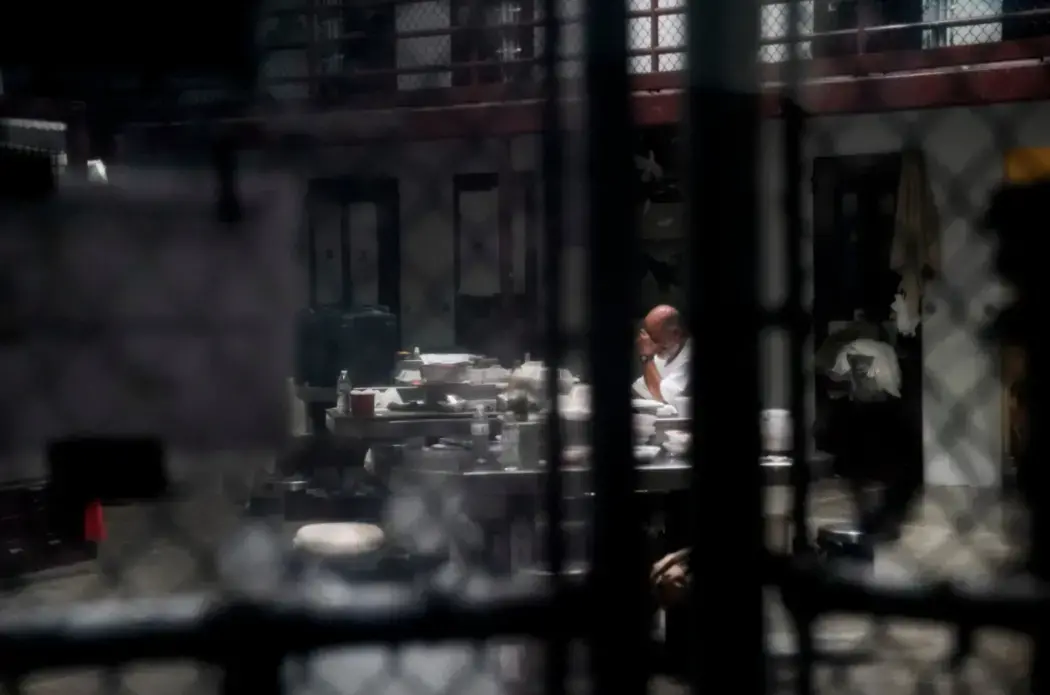 A detainee at Guantánamo Bay in 2019. This year, court activity there has slowed once again. Image by Doug Mills/The New York Times. United States, 2019.