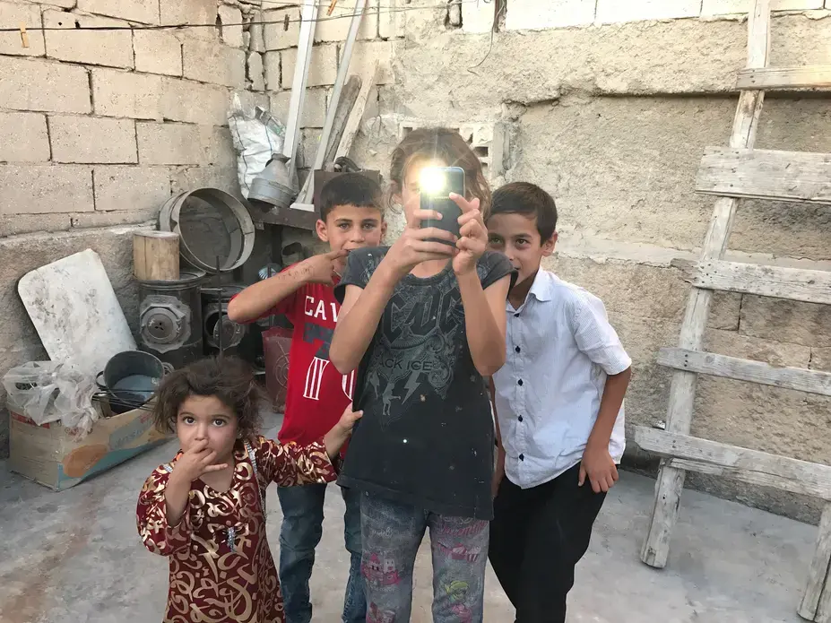 Little ones in a house being restored in Manbij, Syria, one year after the town's liberation from ISIS. Image by Gayle Tzemach Lemmon. Syria, 2017. 
