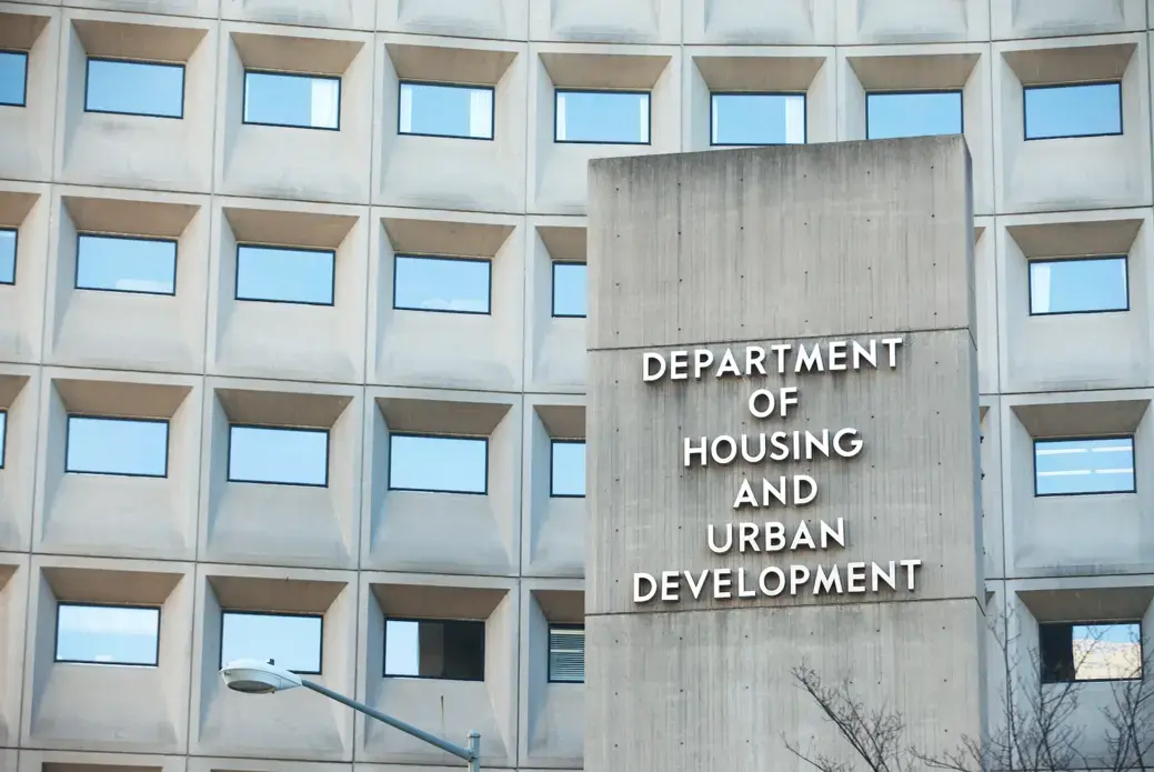 Sign in front of the Department of Housing and Urban Development in downtown Washington, D.C. Image by Mark Van Scyoc / Shutterstock. United States, 2014.