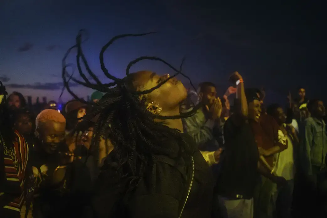 A music fan dances in a mosh pit at the African debut event of the Afropunk music festival hosted at Constitution Hill in Johannesburg. Image by Melissa Bunni Elian. South Africa, 2017.