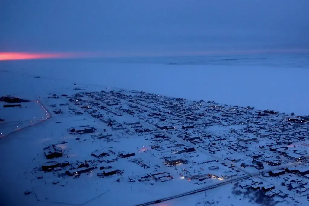 The sun rises on the horizon in Nome, Alaska. Image by Wong Maye-E. United States, 2019.