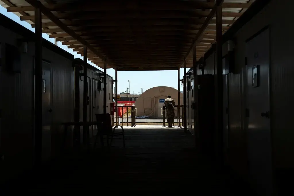 The complaint comes a month after a group of senators expressed concern about the Guantánamo prison’s capacity to protect troops and prisoners from the pandemic. Image by Doug Mills/The New York Times. Cuba, undated.