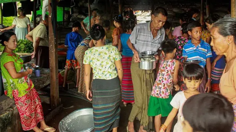 Internally displaced persons (IDPs) cook at a camp in Rakhine State last week. With social distancing nearly impossible, IDPs are at risk of contracting the coronavirus. Myanmar, 2020.