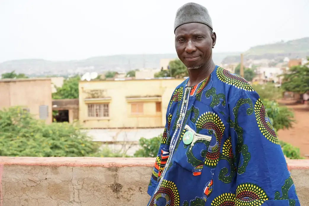 Amadou Coulibaly outside his office at the Malian Association for Deportees in Bamako, Mali. Image by Sébastien Rieussec/Foreign Policy. Mali, 2017.