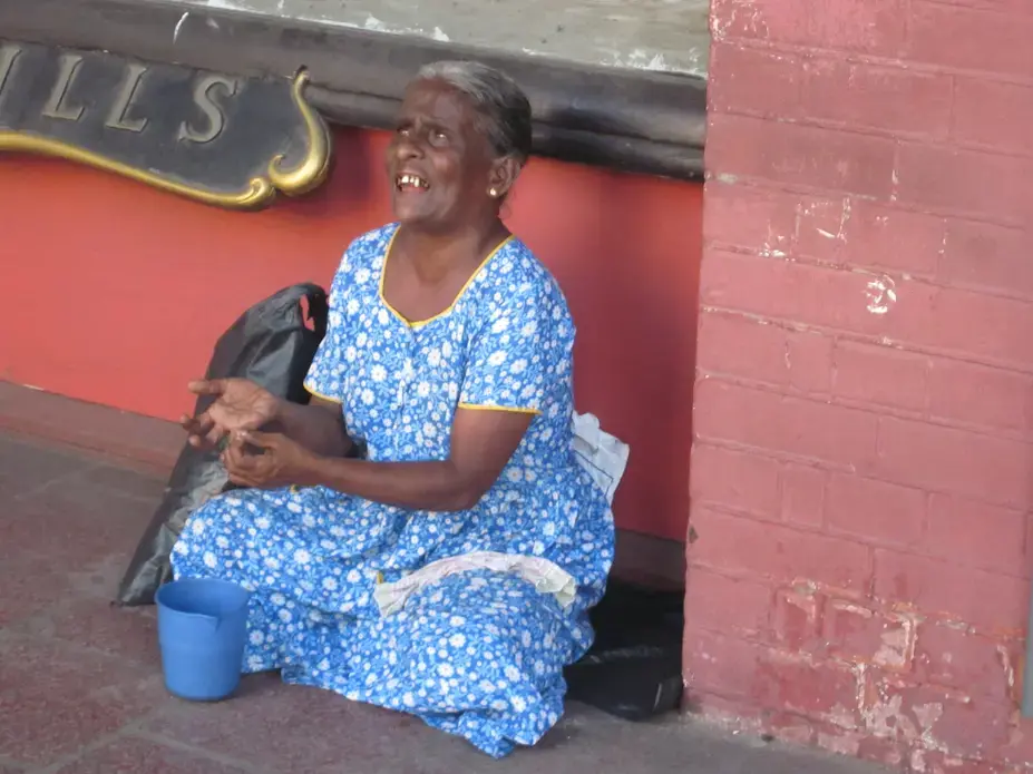 Blind woman sitting outside a shop in Colombo. Image by Ross Velton. Sri Lanka, 2015.