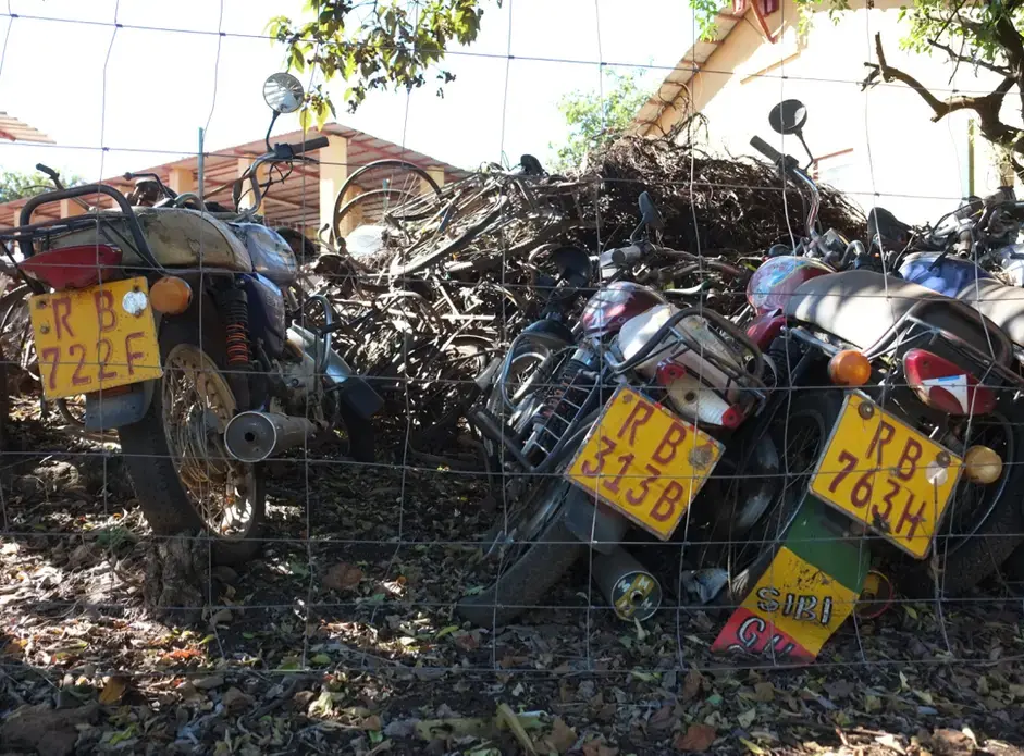 Confiscated poacher bicycles and motorbikes in Akagera, protected by a smaller, electrified fenced area. Image by Elham Shabahat. Rwanda, 2017.<br />
