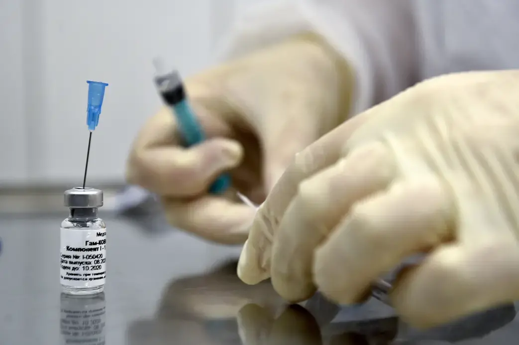 A nurse prepares to inoculate volunteer Ilya Dubrovin, 36, with Russia's new coronavirus vaccine in a post-registration trials at a clinic in Moscow on September 10, 2020. Russia announced last month that its vaccine, named "Sputnik V" after the Soviet-era satellite that was the first launched into space in 1957, had already received approval. The vaccine was developed by the Gamaleya research institute in Moscow in coordination with the Russian Defence Ministry. Image by Natalia Kolesnikova/AFP. Russia,…