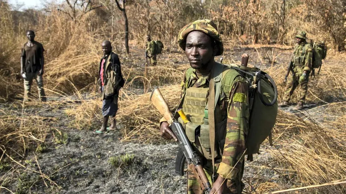 After days of pursuit, Chinko's rangers have caught two suspected poachers deep in the Chinko bush. A raid on a their camp uncovered shotguns, machetes and carcasses of antelope, buffalo, crocodile, hippo and monkey. Image by Jack Losh. Central African Republic, 2018.
