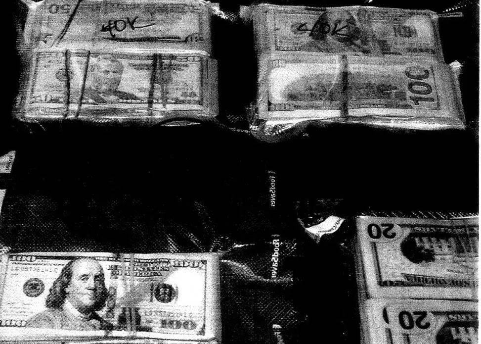 Money seized from a St. Matthews, KY hotel in February 2018 through asset forfeiture. Image courtesy of Jefferson County Circuit Court. United States, 2018.